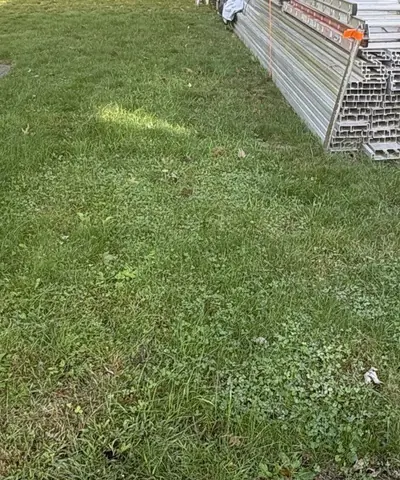 Before: a backyard lawn with long, uneven grass and clover, next to a stack of aluminum staging. A label under the photo points to the long, uneven grass.
